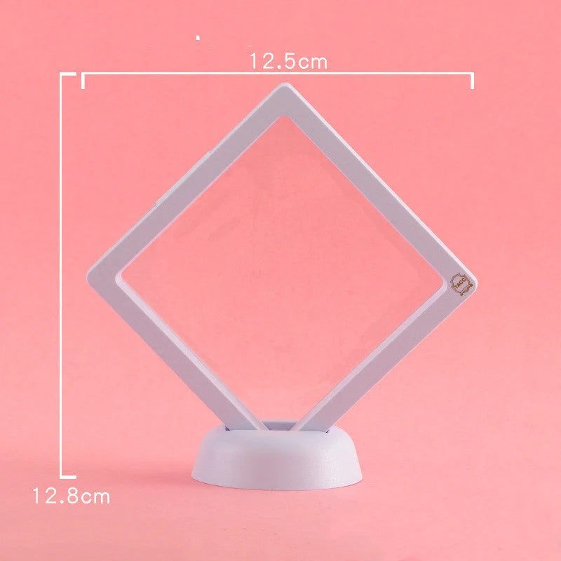 3D floating jewelry display stand showcasing earrings and coins in mid-air