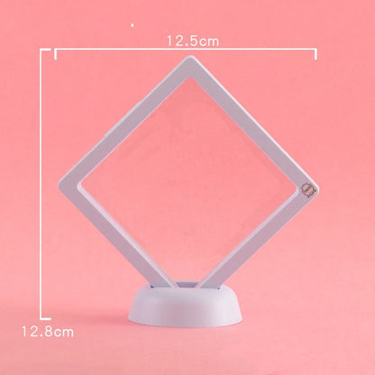 3D floating jewelry display stand showcasing earrings and coins in mid-air