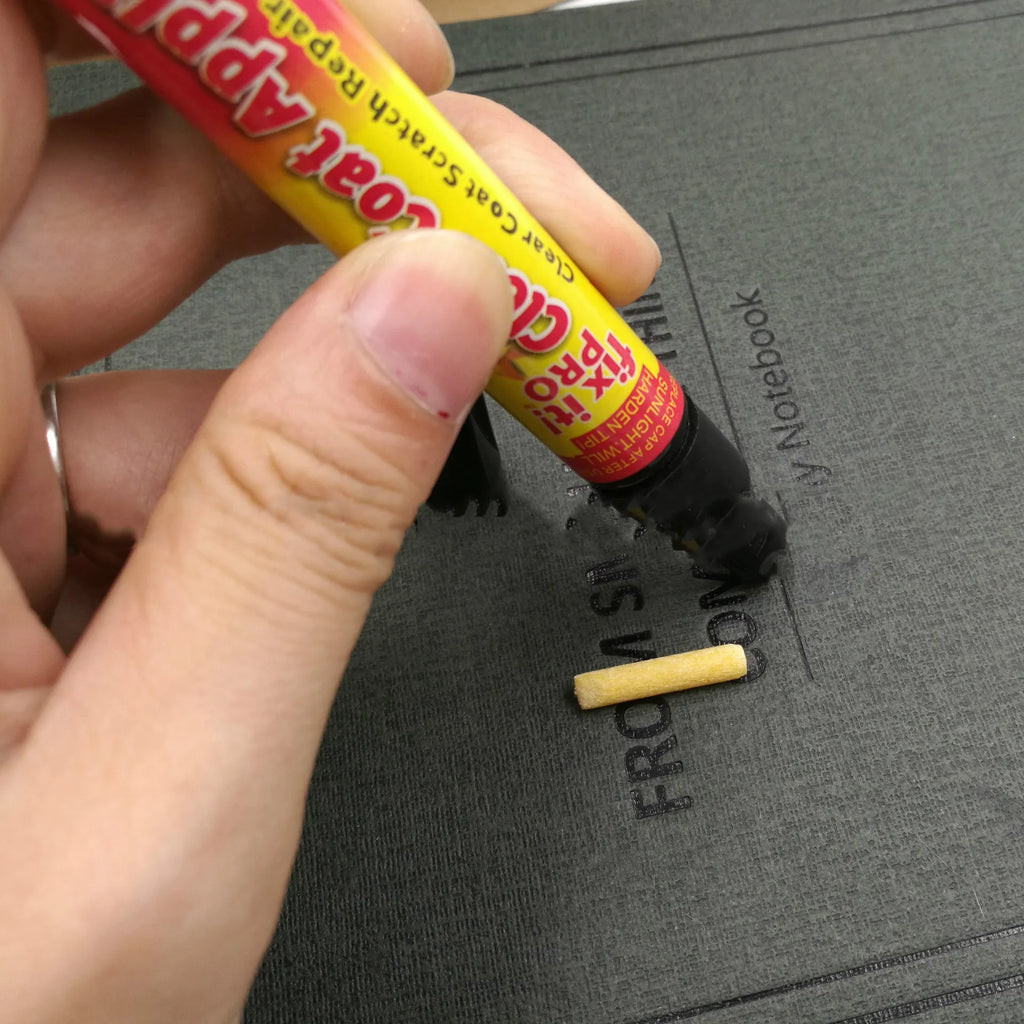 Transoceanic car touch-up pen with clear coat repair resin in aluminum tube, on surface