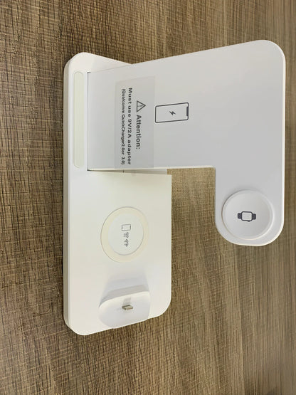 Black three-device wireless charger with phone and watch charging on non-slip base