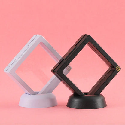 3D floating jewelry display stand showcasing earrings and coins in mid-air