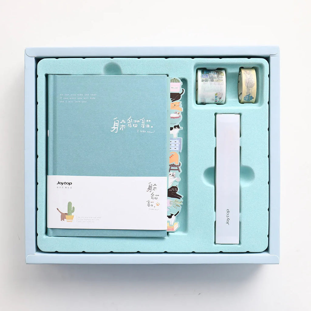 Peekaboo Gift Box Hand Ledger journal with pen in blue, green, pink, or purple cover.