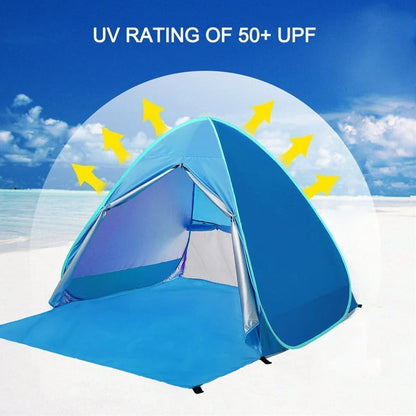 Blue automatic pop-up camping tent fully deployed showing interior space and round storage bag