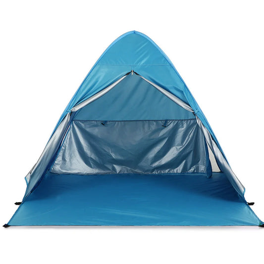 Blue automatic pop-up camping tent fully deployed showing interior space and round storage bag