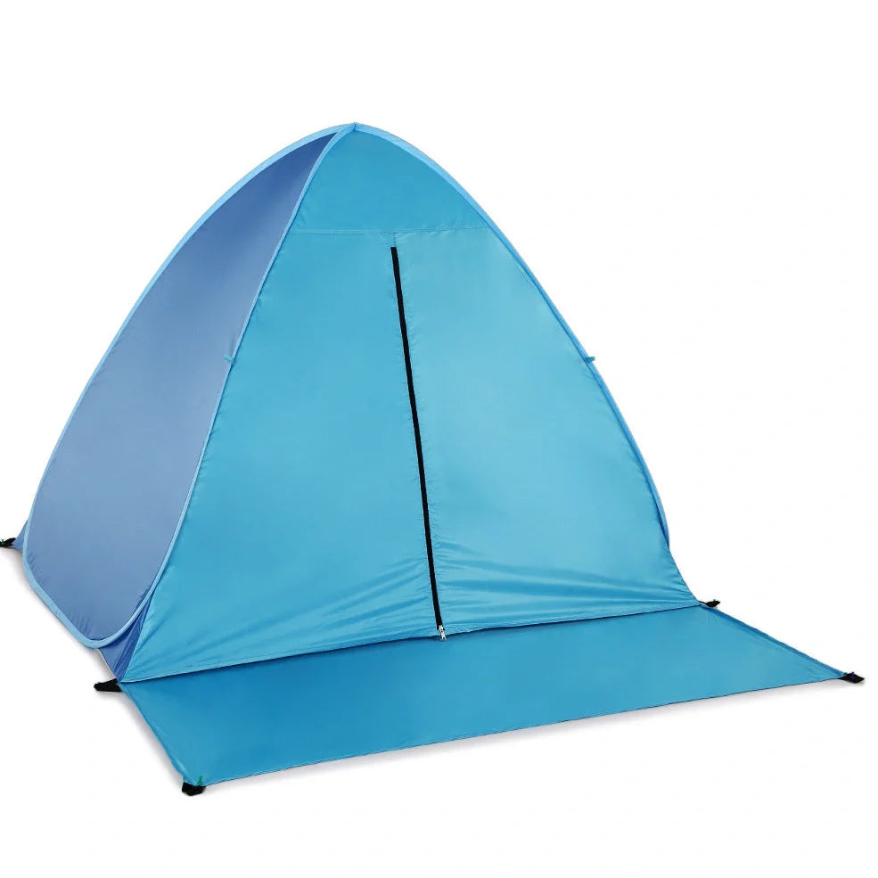 Blue automatic pop-up camping tent fully deployed showing interior space and round storage bag