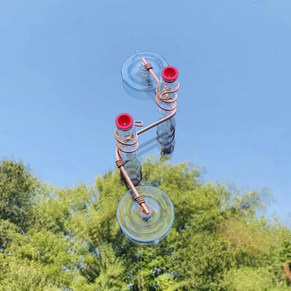 Handcrafted copper wire hummingbird feeder with transparent PET bottles for easy nectar monitoring, perfect for Kiwi gardens