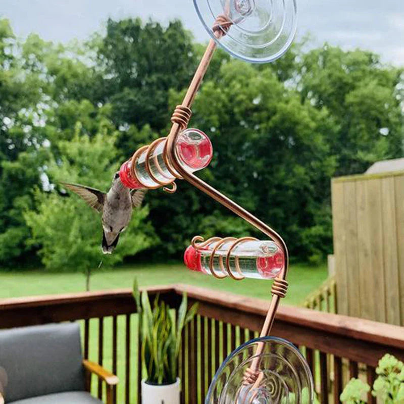 Handcrafted copper wire hummingbird feeder with transparent PET bottles for easy nectar monitoring, perfect for Kiwi gardens