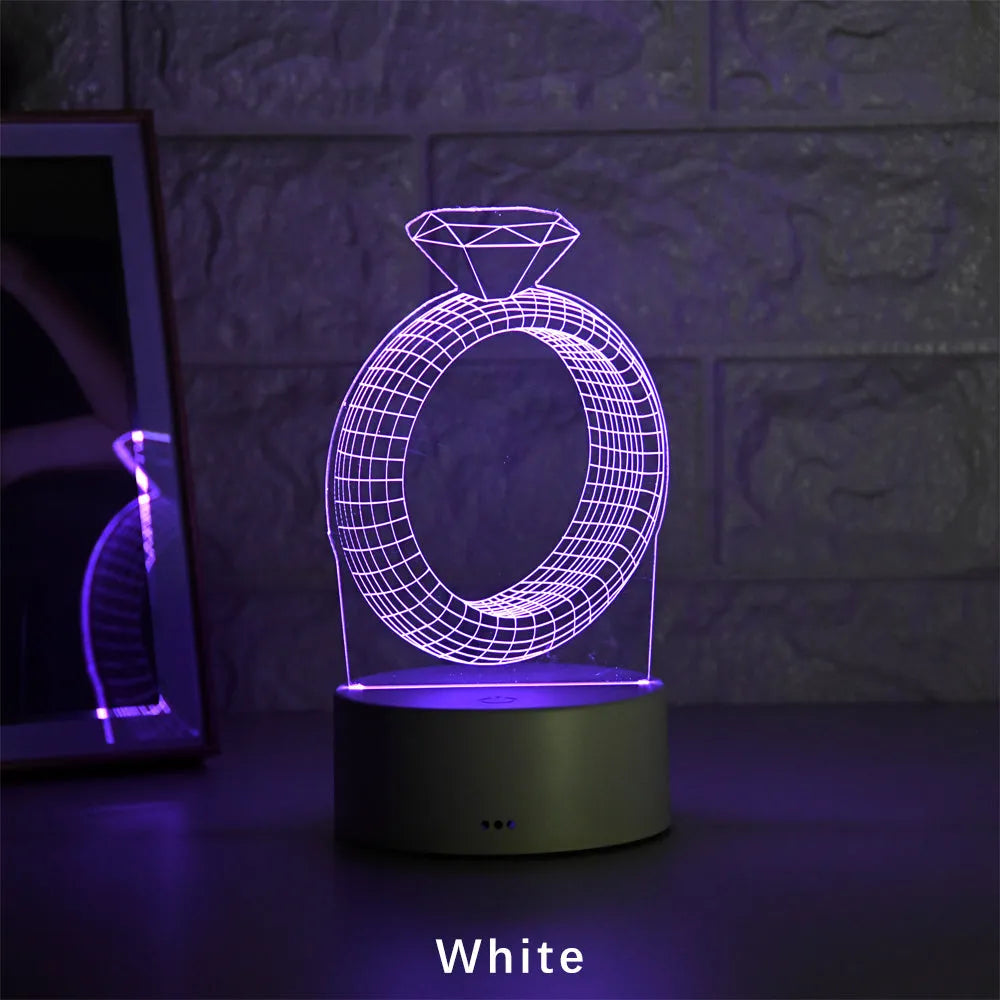 3D LED night light with laser-engraved diamond ring design on colour-changing acrylic panel.