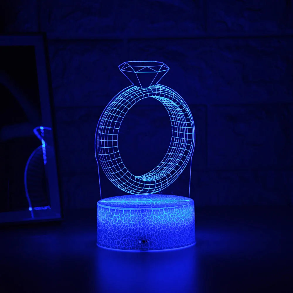 3D LED night light with laser-engraved diamond ring design on colour-changing acrylic panel.