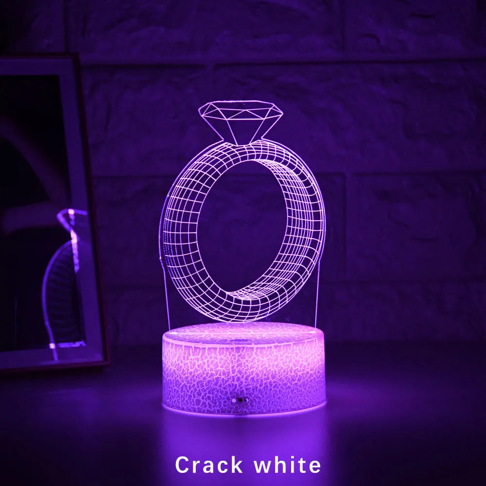 3D LED night light with laser-engraved diamond ring design on colour-changing acrylic panel.