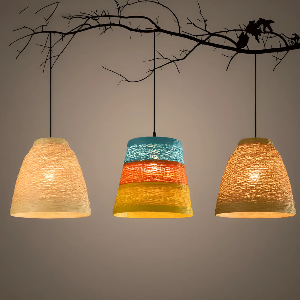 Natural woven rattan spherical hanging lamp with an adjustable cord on a light background.