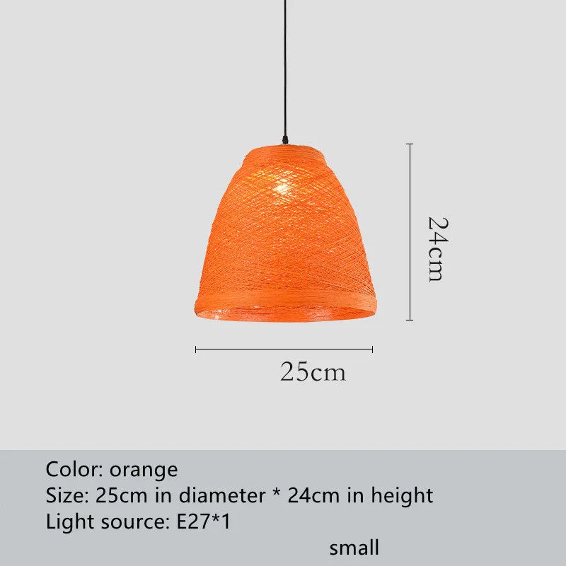 Natural woven rattan spherical hanging lamp with an adjustable cord on a light background.