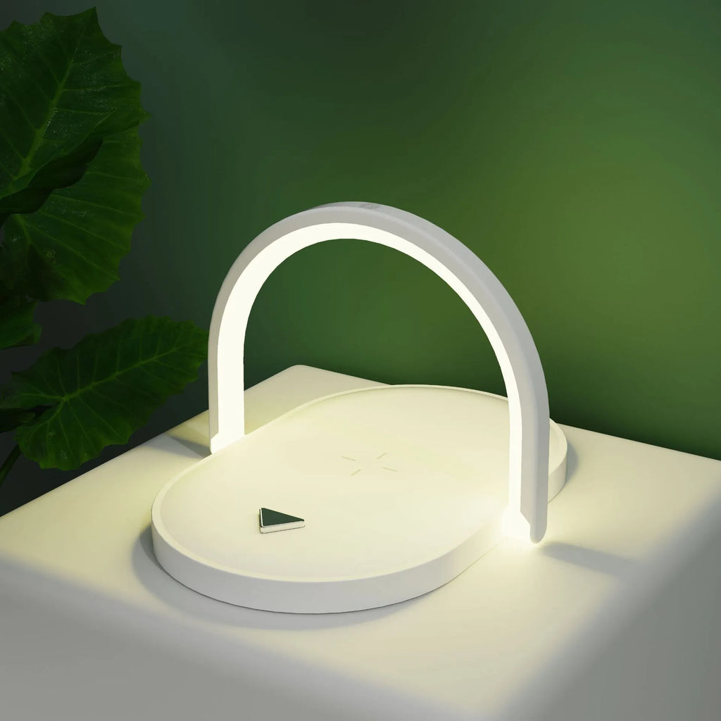 Black and white wireless charger night light with phone holder showing 15W fast charging capability