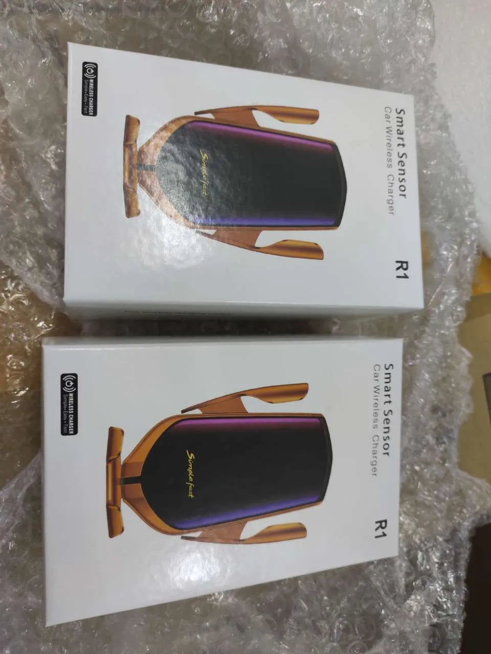 Magic Clip R1 automatic wireless charging car phone holder in gold mounted on car air vent