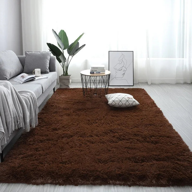 Nordic fluffy plush rectangular carpet with anti-slip base in beige colour on wooden floor