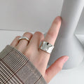 Big wide geometric 925 silver ring with adjustable opening, silver finish, on finger