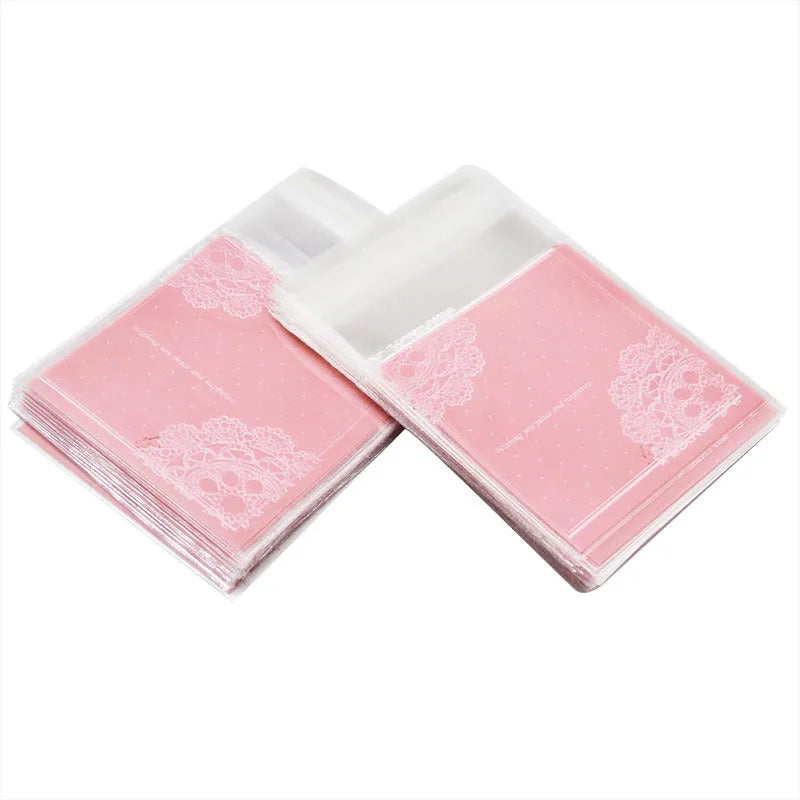 Pink self-adhesive plastic packaging bag for handmade soap with a gusseted side.