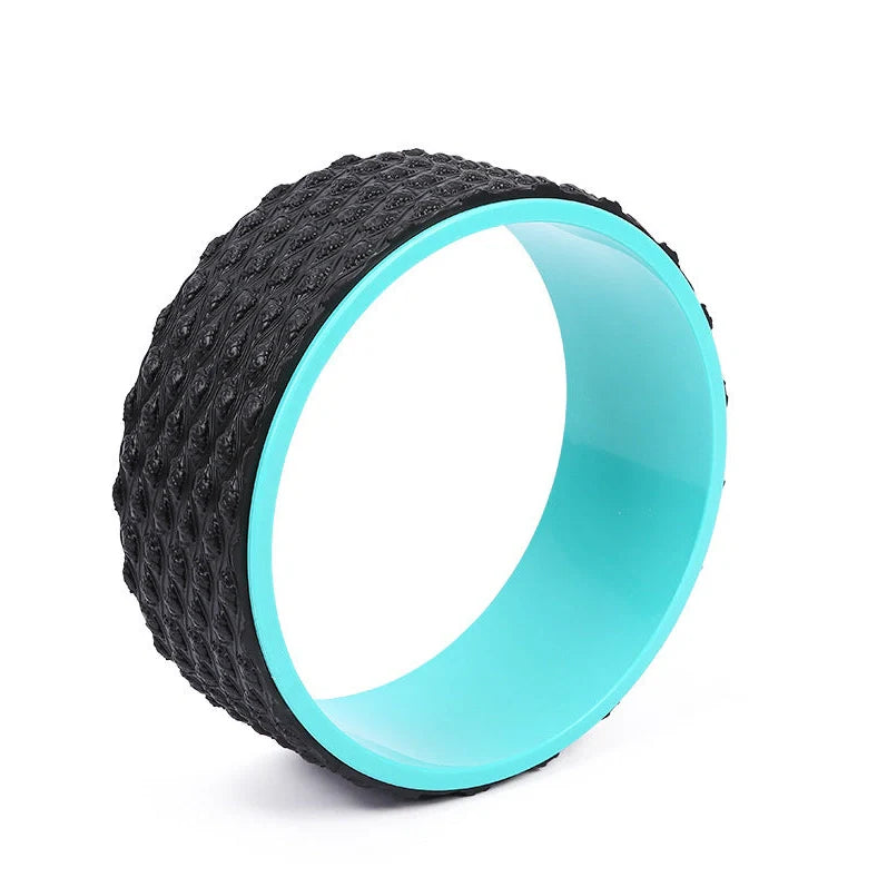 Purple yoga wheel with massage point surface measuring 113cm long and 32cm diameter for muscle relaxation