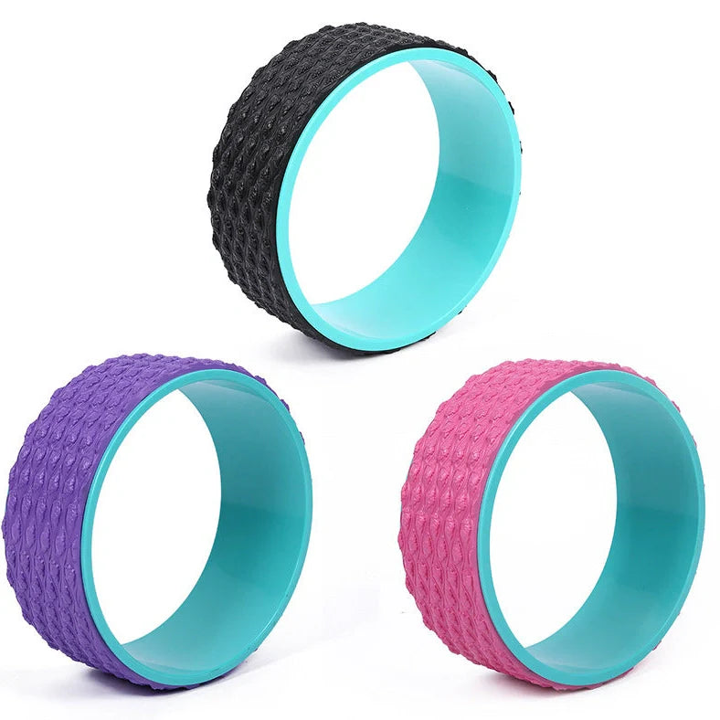 Purple yoga wheel with massage point surface measuring 113cm long and 32cm diameter for muscle relaxation