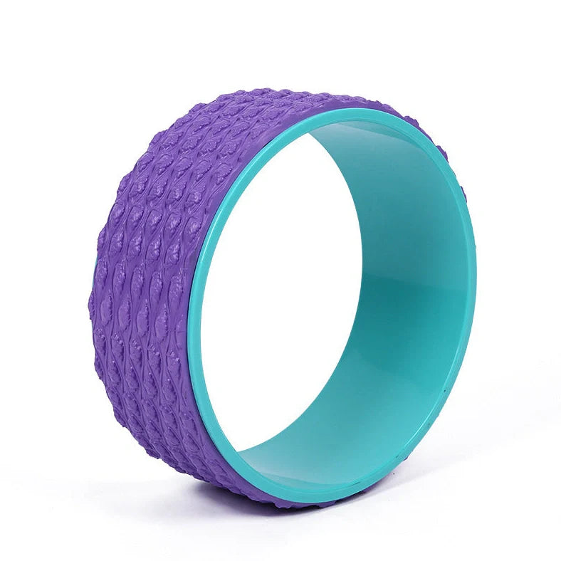Purple yoga wheel with massage point surface measuring 113cm long and 32cm diameter for muscle relaxation