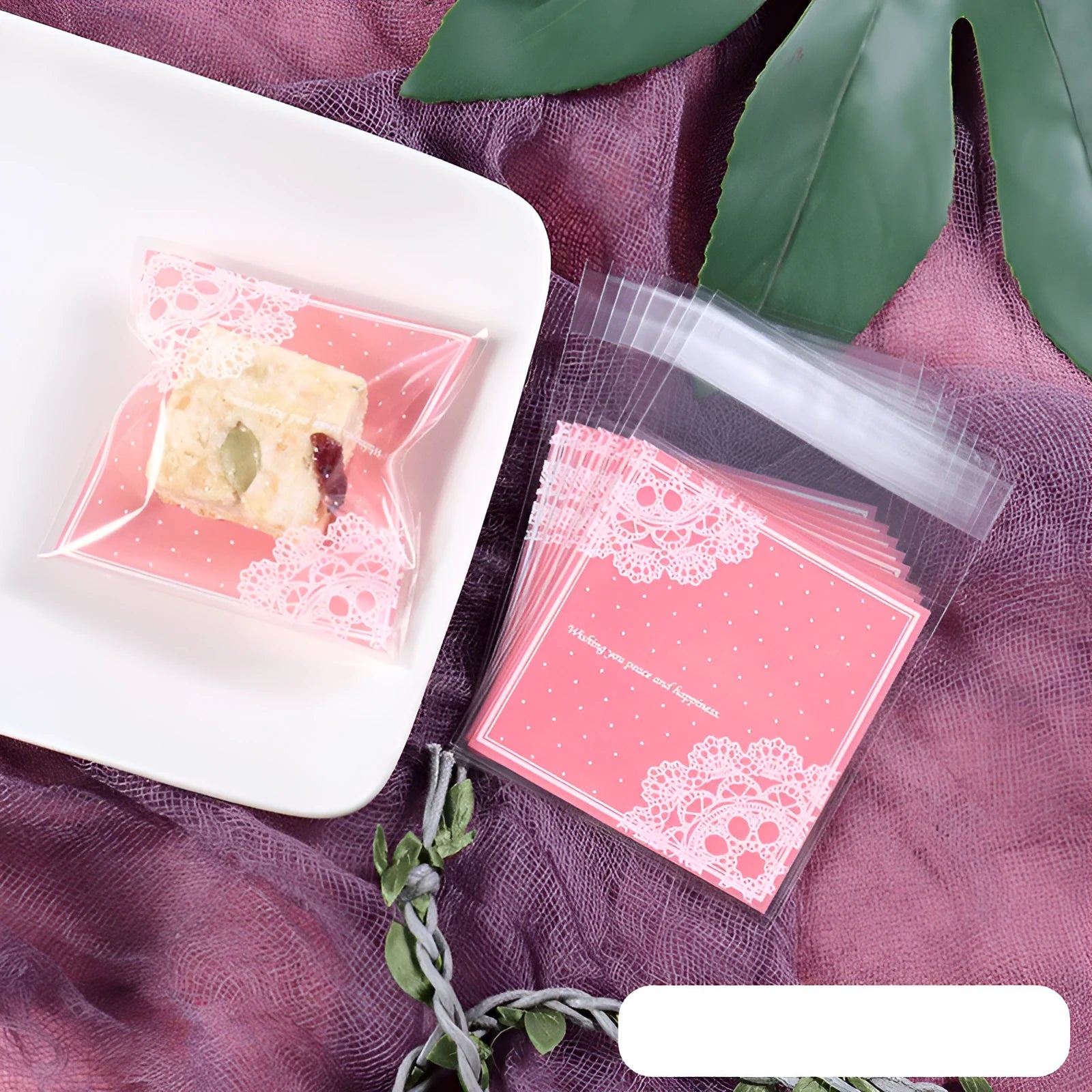 Pink self-adhesive plastic packaging bag for handmade soap with a gusseted side.