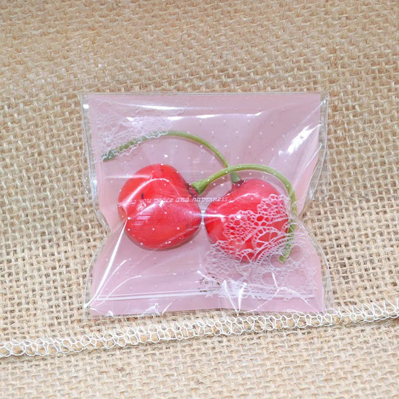 Pink self-adhesive plastic packaging bag for handmade soap with a gusseted side.