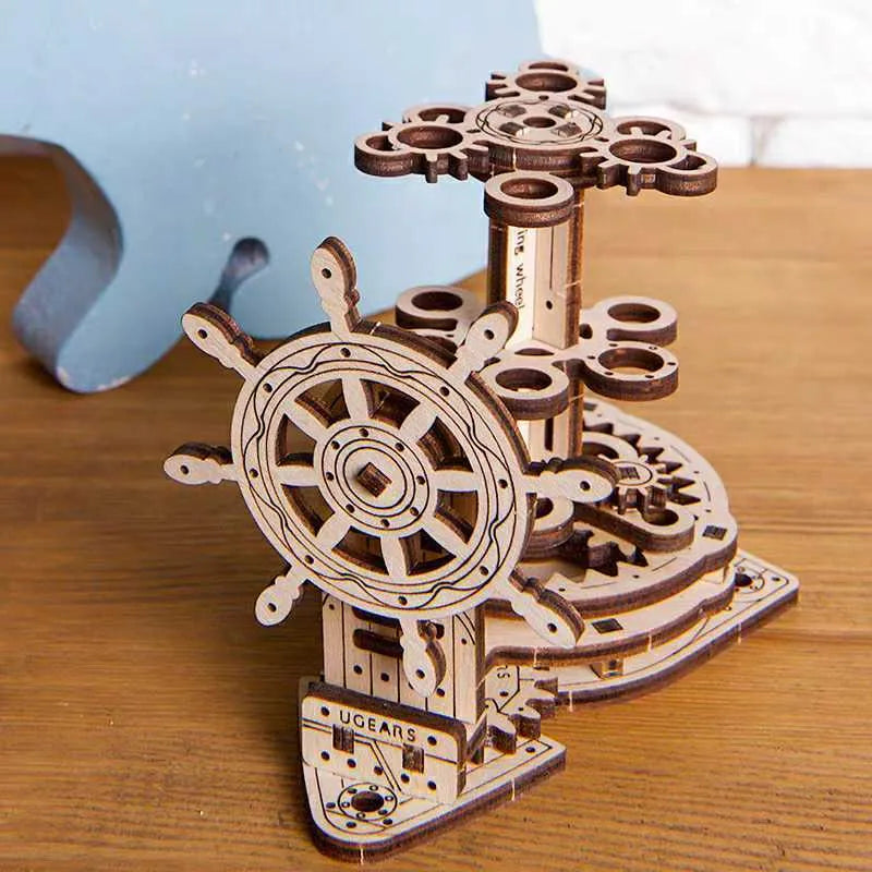 Ukrainian wooden rotating model pen holder on a desk.