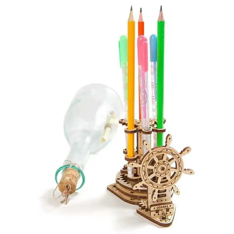 Ukrainian wooden rotating model pen holder on a desk.