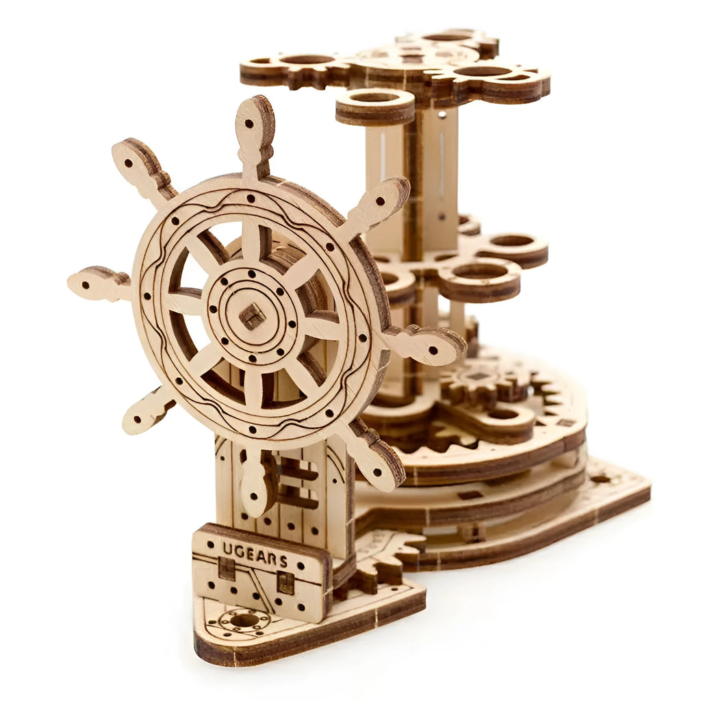 Ukrainian wooden rotating model pen holder on a desk.