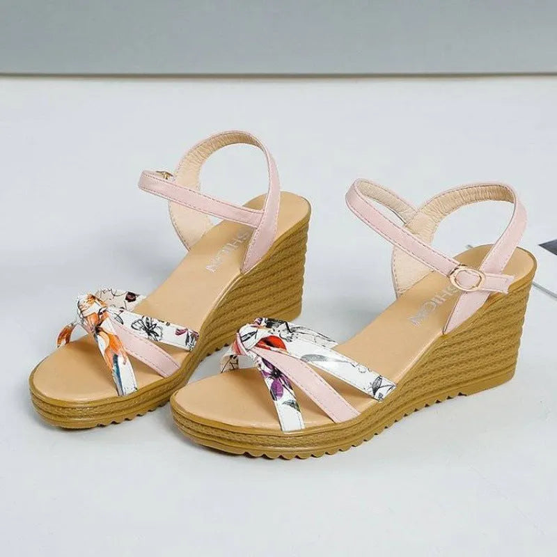 Women's pink and white PU wedge sandals with a thick heel, fish mouth design, and buckle closure.