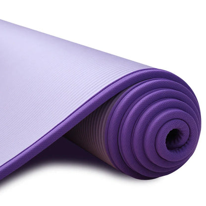 Wrapped non-slip yoga mat showing 10mm thickness and 183cm length with textured surface