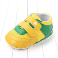 Toddler boy breathable mesh soft-soled sneakers in red and black with non-slip sole on a light background