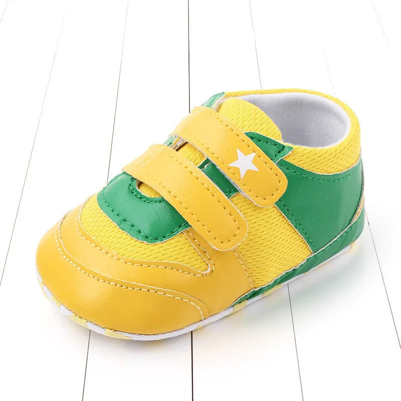 Toddler boy breathable mesh soft-soled sneakers in red and black with non-slip sole on a light background