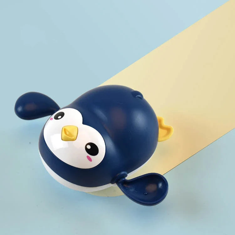 Adorable wind-up penguin bath toy with kawaii design, floating and swimming capabilities, and Montessori-inspired educational features