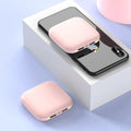 Compact black 20000mAh power bank with LED flashlight, showing size scale