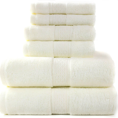 Pure cotton absorbent towel set in bamboo green, showing 140x70cm bath, 33x73cm hand, and 33x33cm square towels