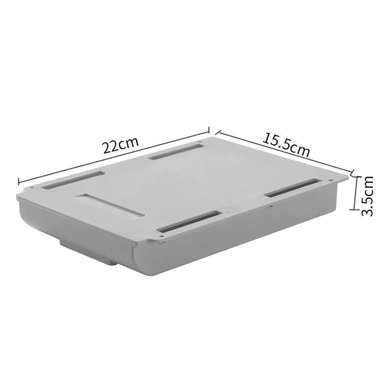 Grey Japanese-style plastic drawer storage box placed under a table for stationery organisation