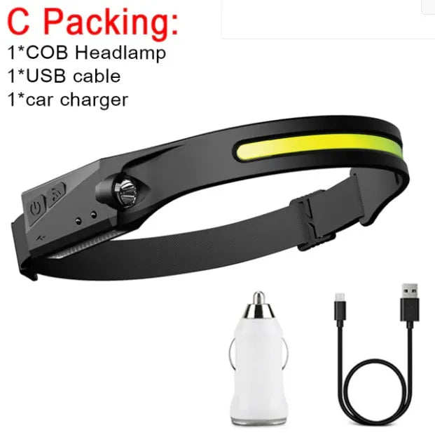 Black silicone induction fishing light with touch switch, shown with USB charging cable and strap.