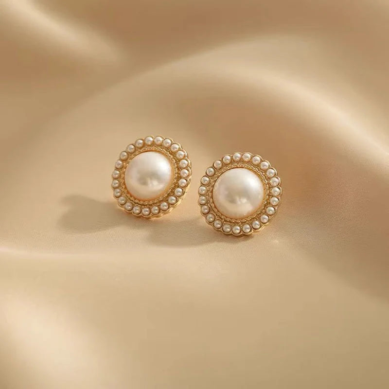 Elegant pearl inlaid alloy earrings in gold, perfect for any occasion