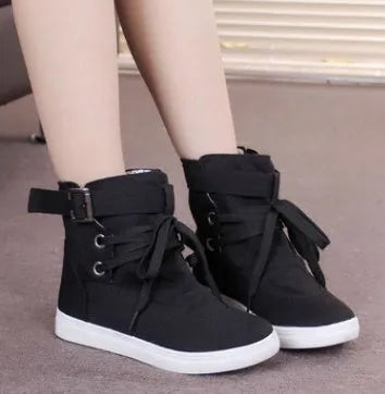 Women's black canvas casual shoes with cross strap detail, flat heel, and lace-up closure on a plain background.