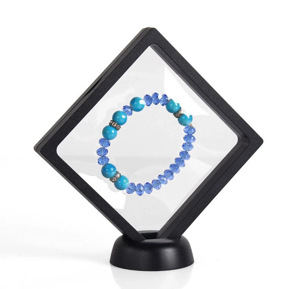 3D floating jewelry display stand showcasing earrings and coins in mid-air