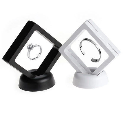 3D floating jewelry display stand showcasing earrings and coins in mid-air
