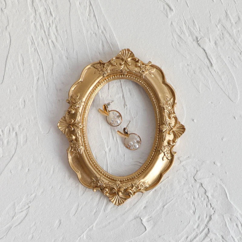 Golden retro photo frame for jewelry and art display, Nordic-style design