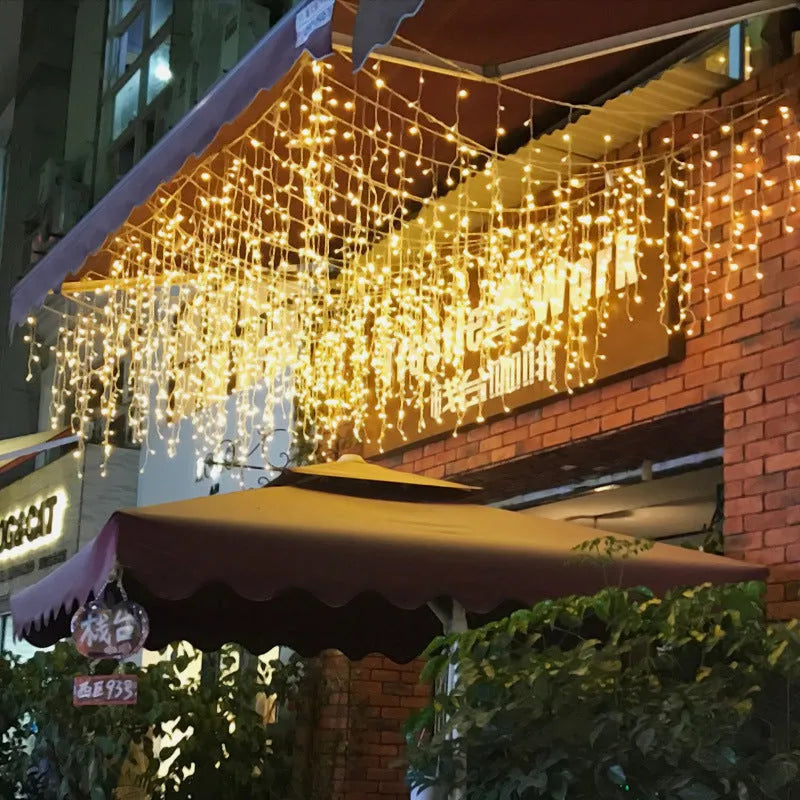 LED starry icicle light string with 96 lights on a 4-metre wire, showing three lengths of icicle drops in warm white illumination