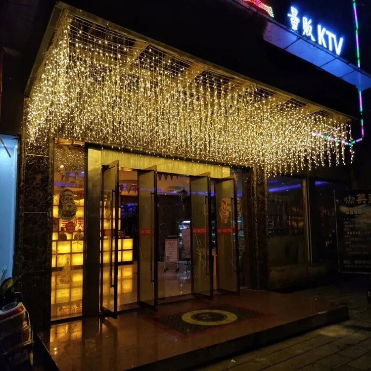 LED starry icicle light string with 96 lights on a 4-metre wire, showing three lengths of icicle drops in warm white illumination