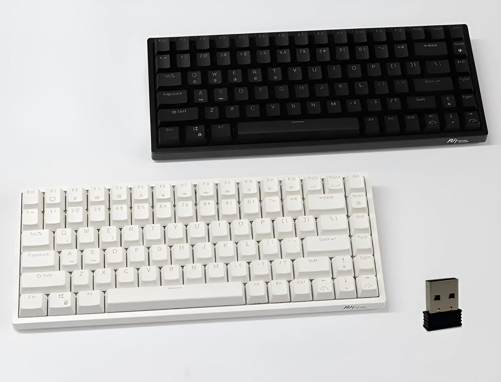 White 84-key mechanical keyboard with RGB backlighting on a wood desk, showcasing its compact layout and USB-C cable.
