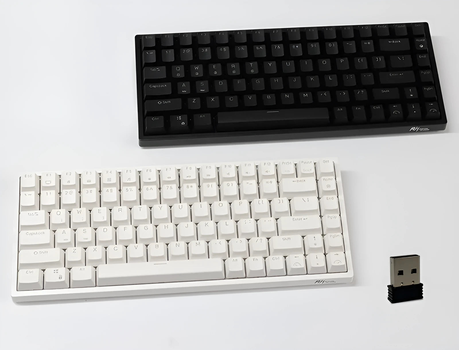 White 84-key mechanical keyboard with RGB backlighting on a wood desk, showcasing its compact layout and USB-C cable.