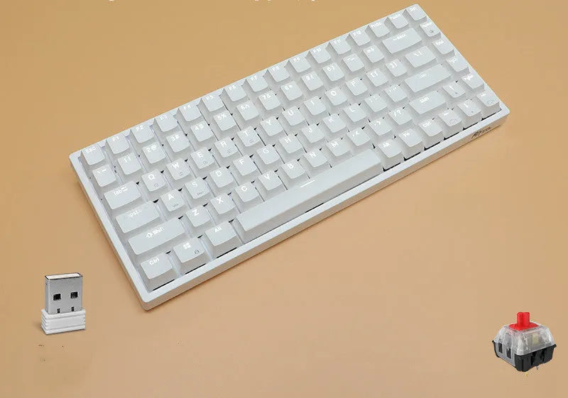 White 84-key mechanical keyboard with RGB backlighting on a wood desk, showcasing its compact layout and USB-C cable.