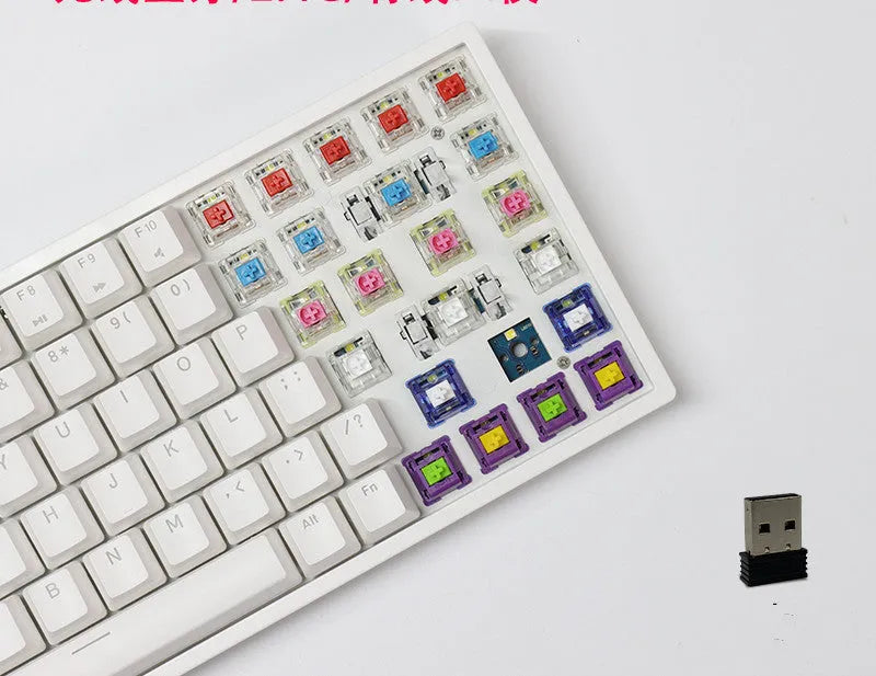 White 84-key mechanical keyboard with RGB backlighting on a wood desk, showcasing its compact layout and USB-C cable.