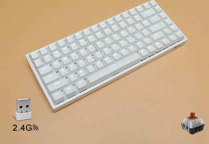 White 84-key mechanical keyboard with RGB backlighting on a wood desk, showcasing its compact layout and USB-C cable.